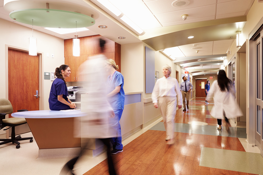 Medical staff walking through the hallway of a medical building