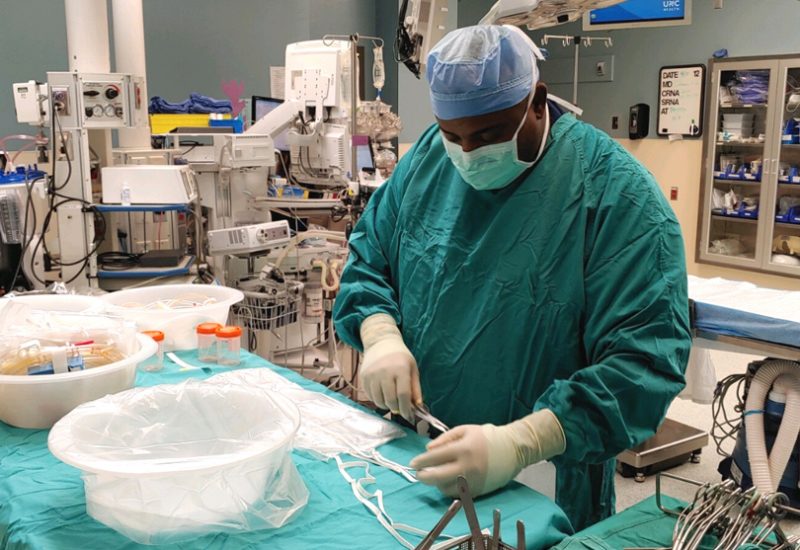 HonorBridge staff member in scrubs at a medical facility