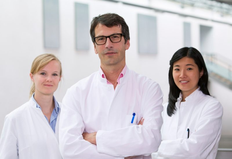 Three medical professionals pose together